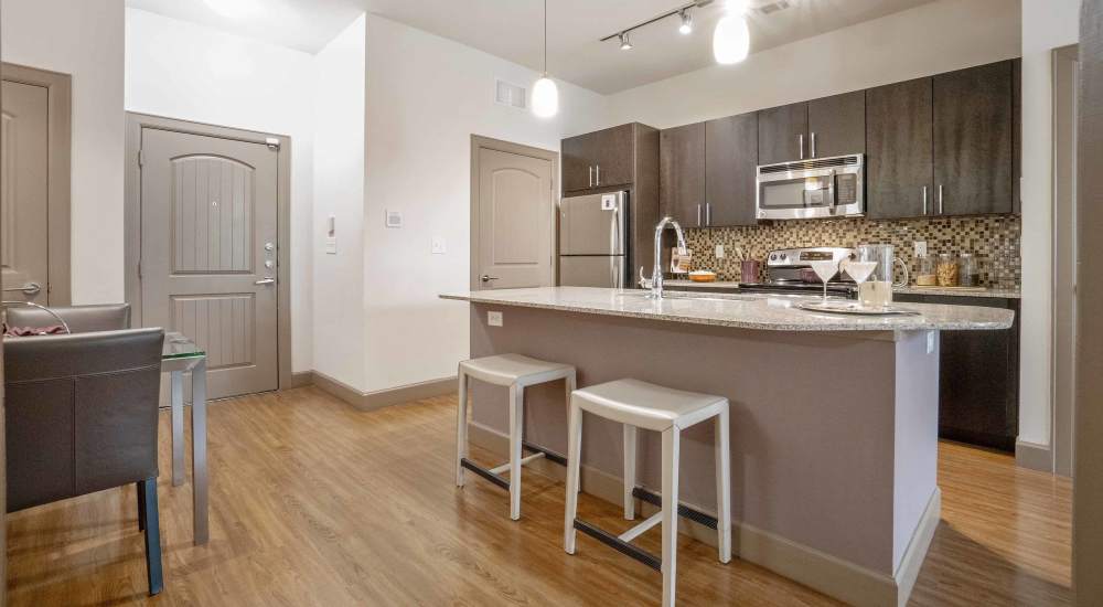 Open kitchen with artistic flooring at Grapevine Station in Grapevine, Texas
