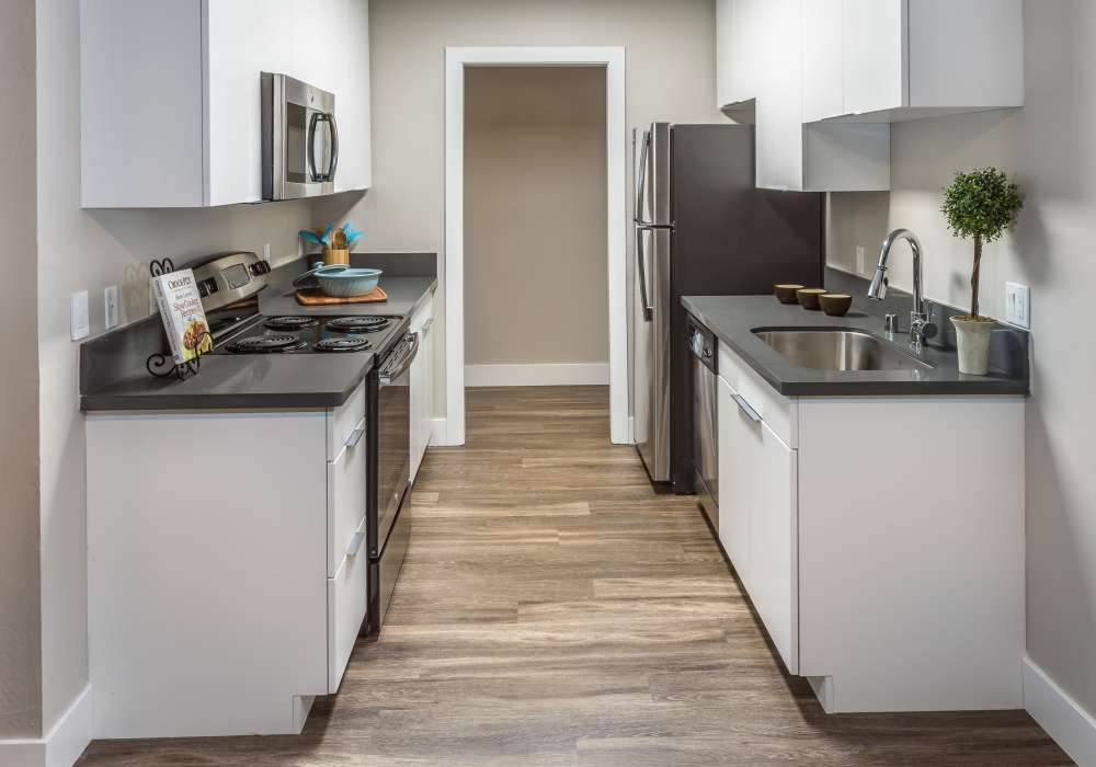 Fully equipped kitchen with wooden flooring at Harbor Cove Apartments in Foster City, California,