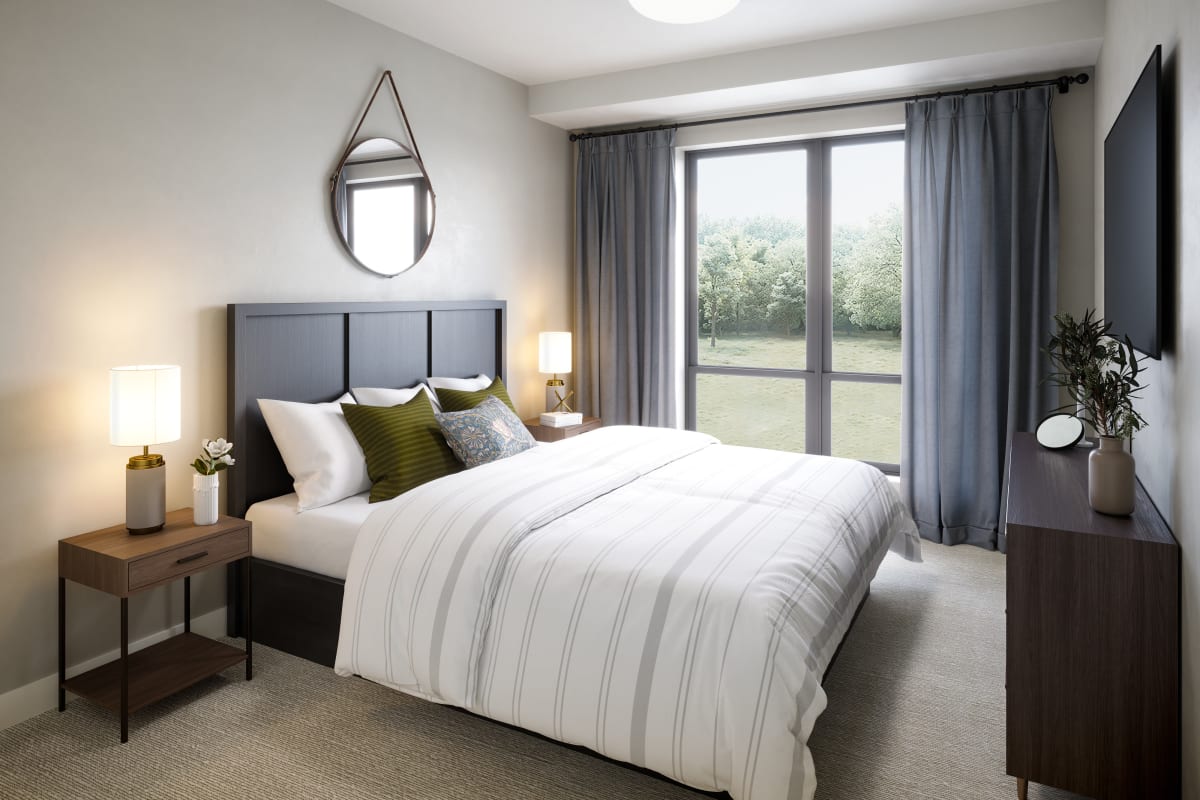 Bedroom decorated with bed, nightstand and dresser at Amira Minnetonka in Minnetonka, Minnesota.