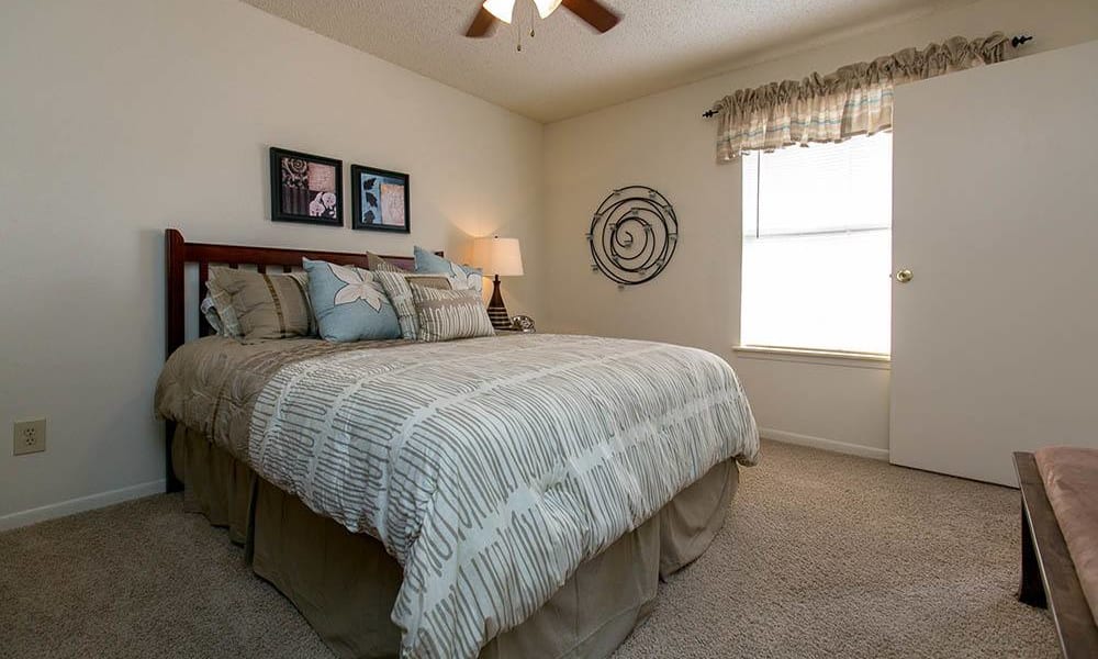 Cozy primary bedroom at Walnut Ridge Apartments in Corpus Christi, Texas