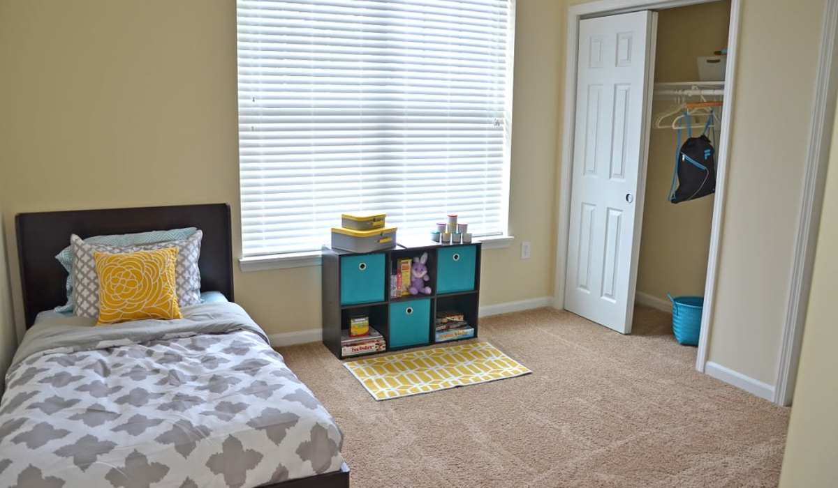 Bedroom with closets at The Enclave Apartments in Columbus. IN
