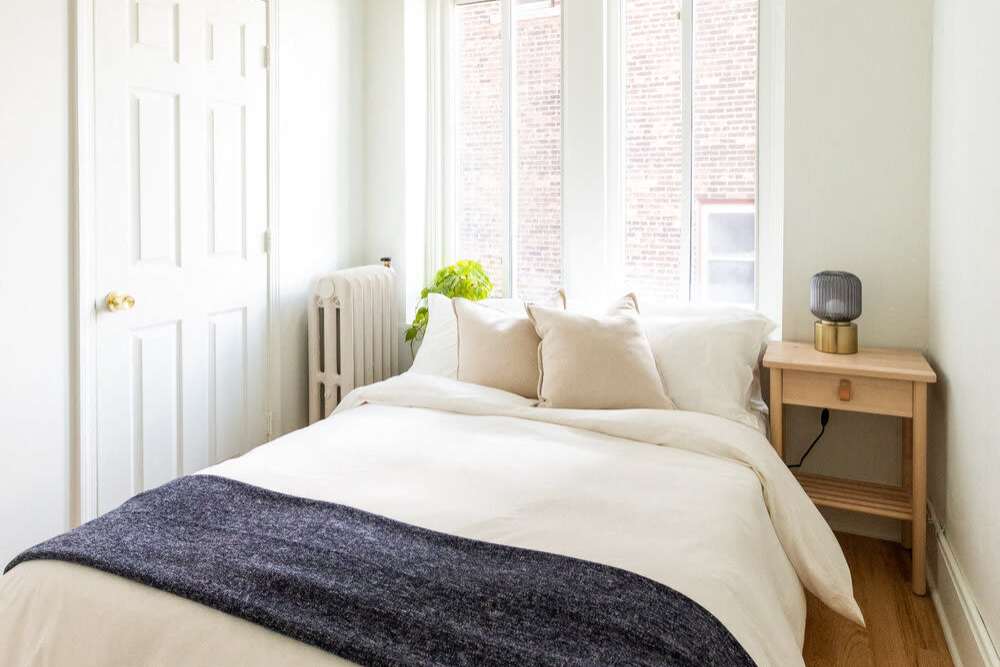 Bright bedroom at Detroit Living in Detroit, Michigan