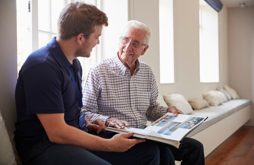 A resident talking to a caretaker at Highland Crest Senior Living in Kirksville, Missouri