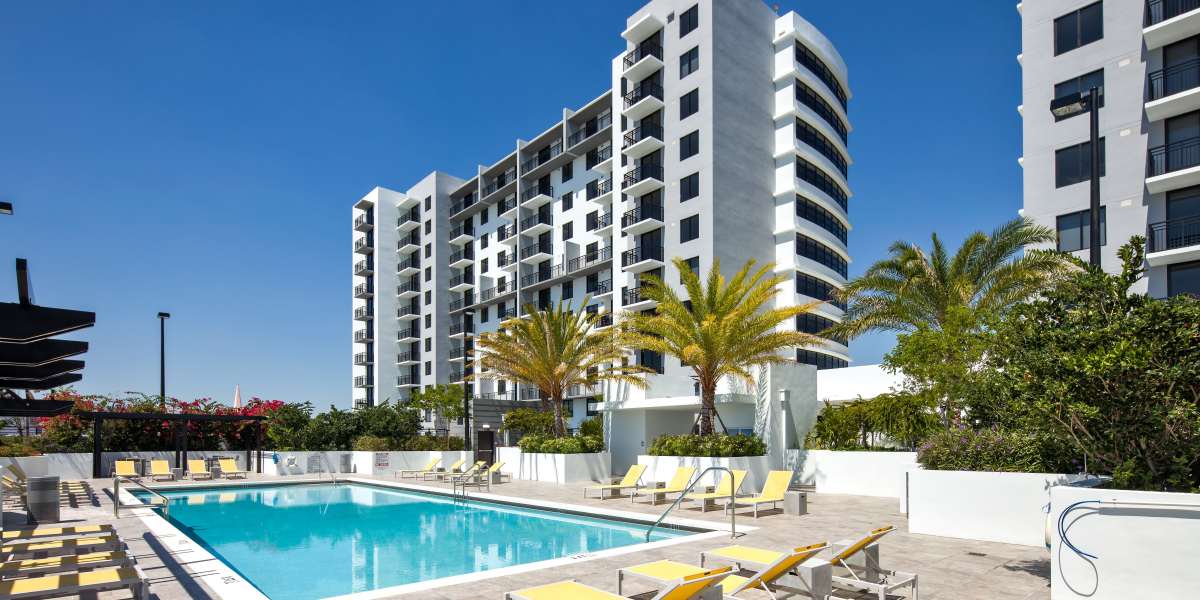 Apartment building exterior and swimming pool at InTown Apartments in Miami, Florida