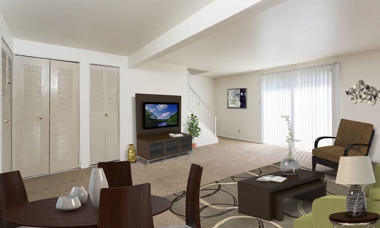 Enjoy family time in your new living room at High Acres Apartments and Townhomes in Syracuse, NY