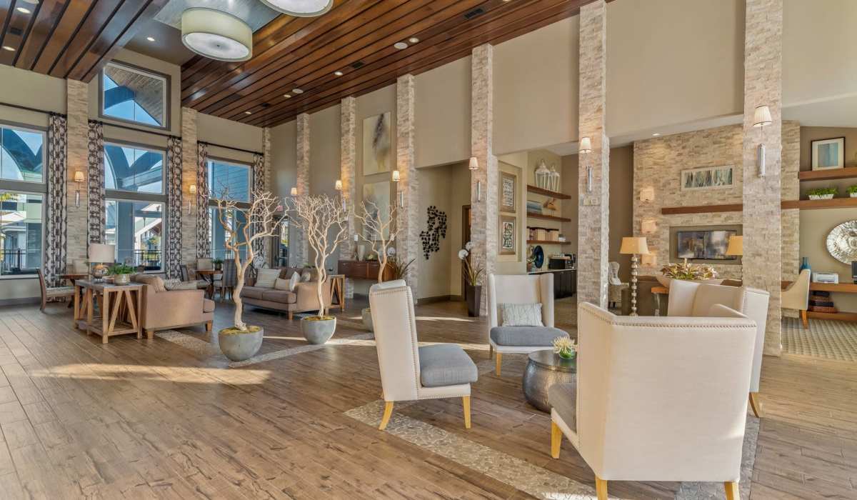 Lounge area with seating and wood-style flooring at The Crosby at Towne Center in Sanford, Florida