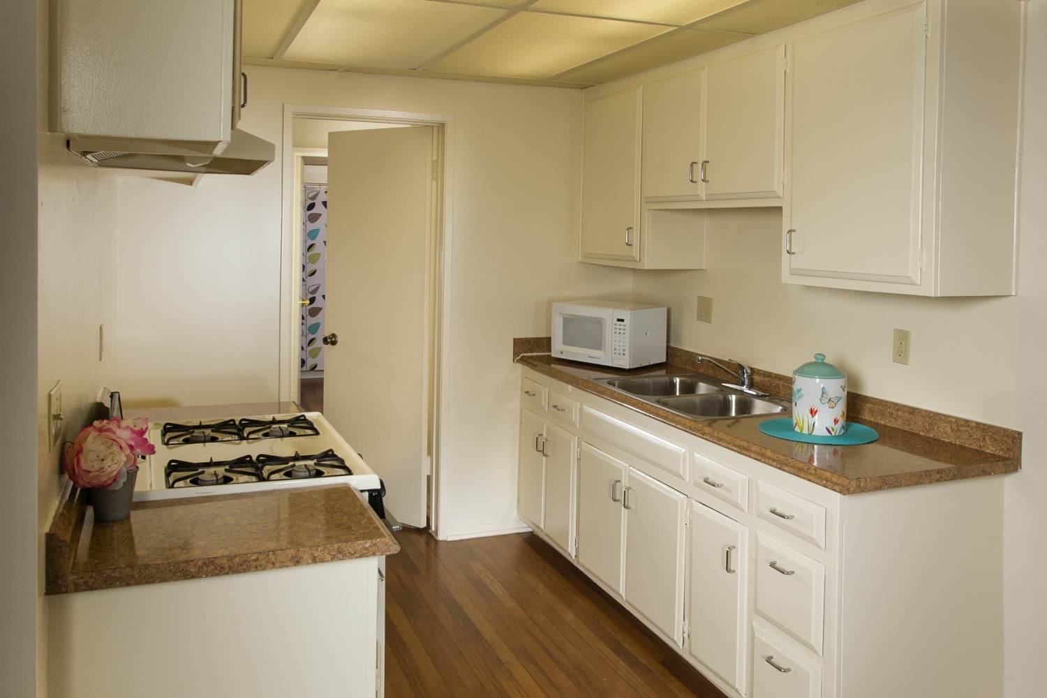 Kitchen with hardwood floors at Chatham Village in Tustin, California