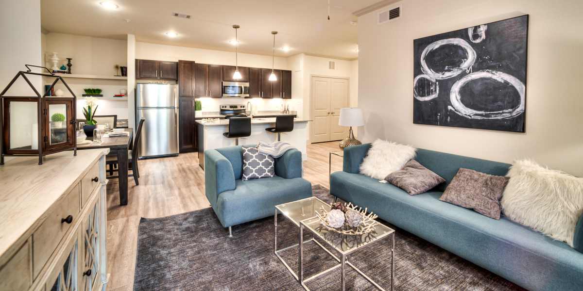 Living room with view to kitchen at Magnolia Park Apartments in Houston, Texas