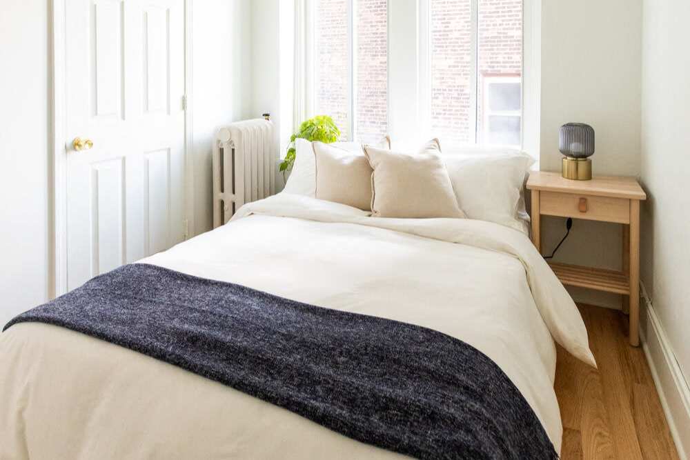 Bright bedroom at Detroit Living in Detroit, Michigan