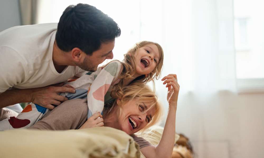 A resident family having a happy laughs at Avonlea Highlands in Cartersville, Georgia