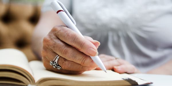 Resident making a list at Holton Manor in Elkhorn, Wisconsin