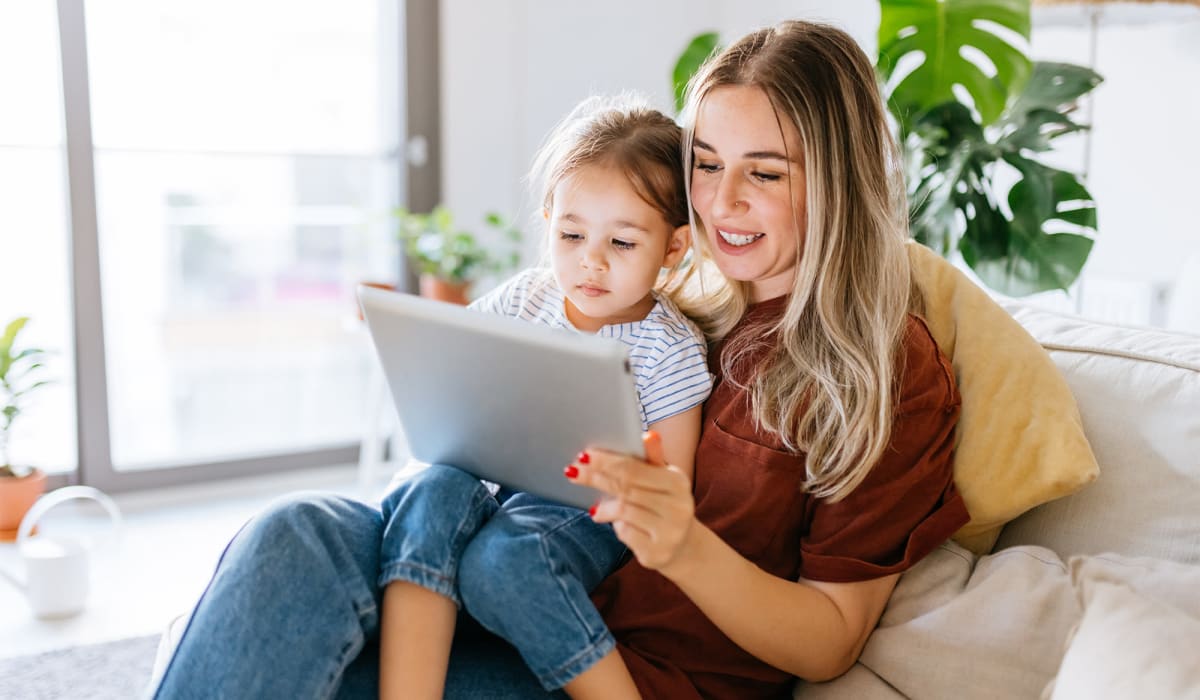 A mother and daughter looking at a tablet at Haven Hill Exchange in Atlanta, Georgia