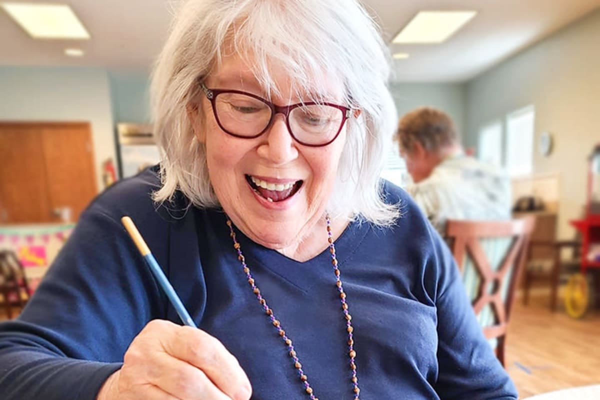 A resident painting at Oxford Senior Living in Wichita, Kansas