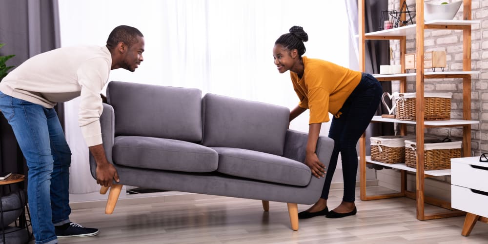 A couple places a couch in their new home near Wrondel Self Storage in Reno, Nevada