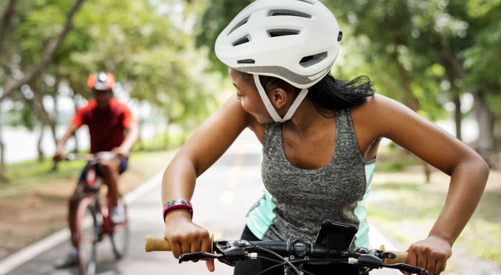 Residents ride their bikes in a park near Chatham Commons in Cranberry Township, Pennsylvania