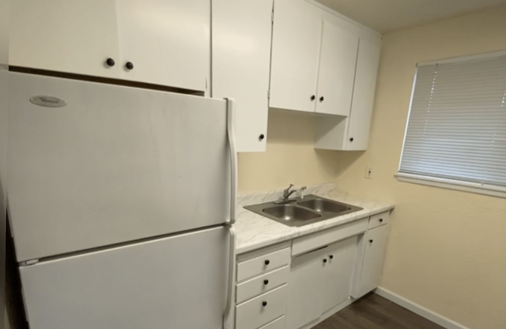 Kitchen with white cabinets at Ridgewood Apartments