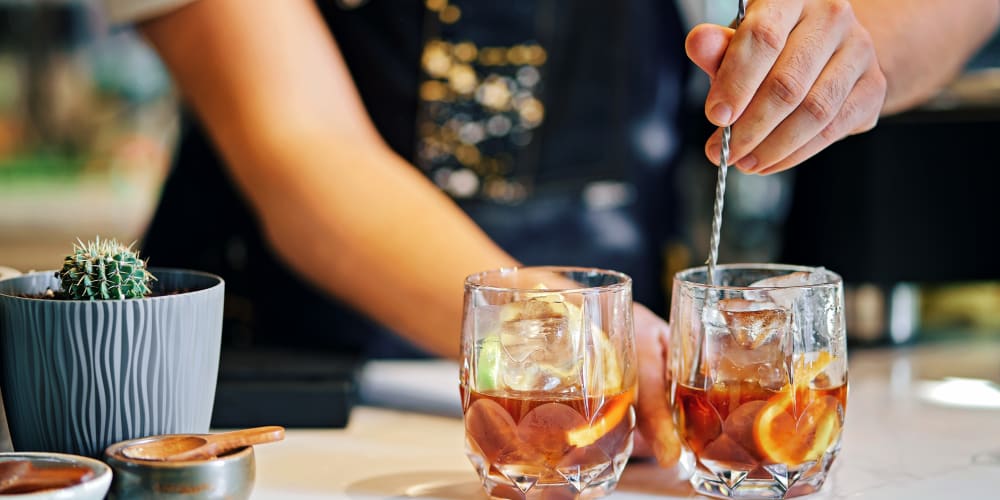 A bar tender mixing drinks near Mallory Square at Lake Nona in Orlando, Florida