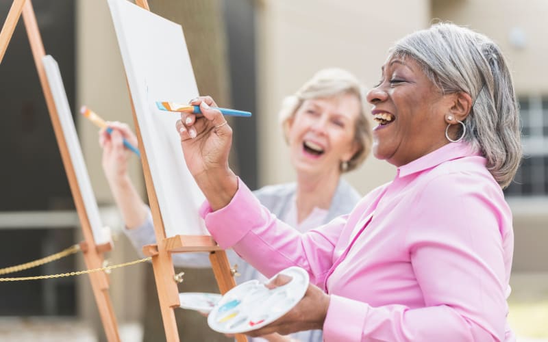 Residents painting outside at All Seasons Naples in Naples, Florida