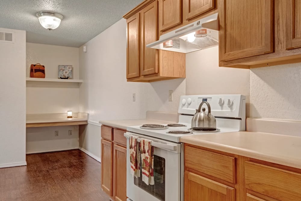 Stainless steel appliances and granite countertops in kitchen at Yukon on 15th in Yukon, Oklahoma