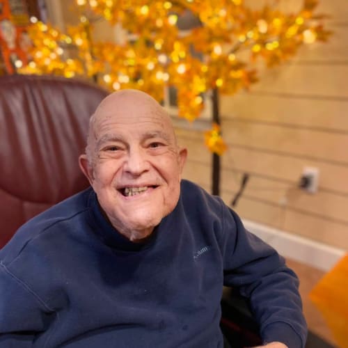 Resident sitting outside at Oxford Glen Memory Care at Owasso in Owasso, Oklahoma