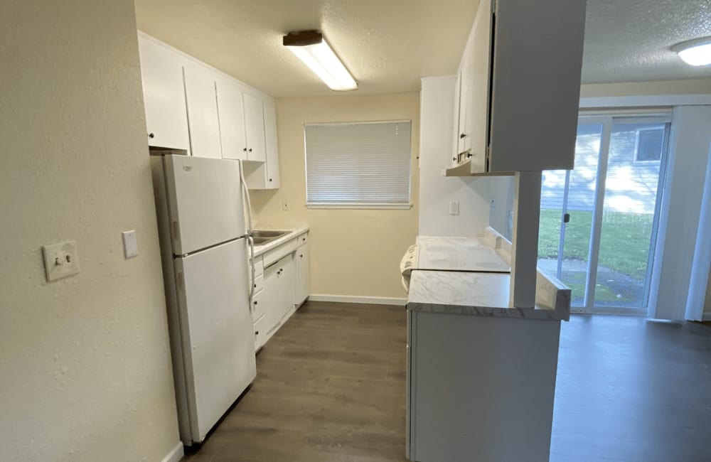 Kitchen with white appliances at Ridgewood Apartments