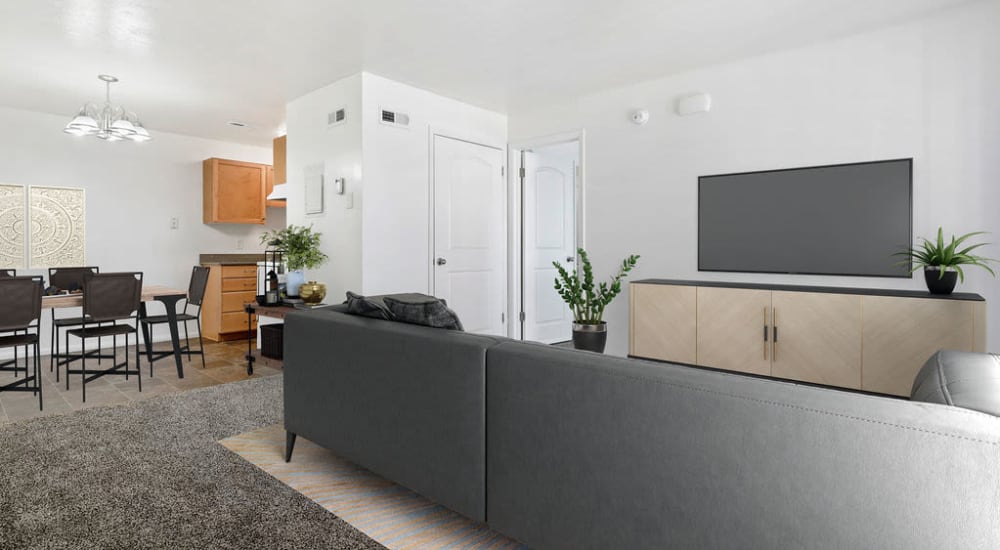 A couch and a coffee table in a model home's living space at Valley Park Apartments in Salt Lake City, Utah