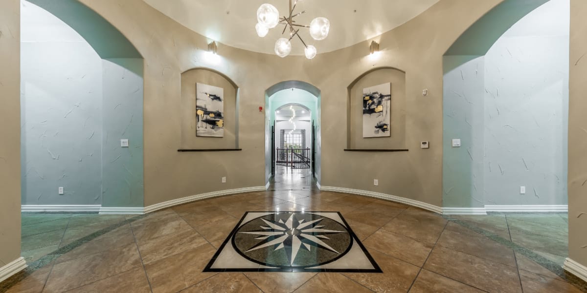 Community clubhouse entrance with decorations and artwork at Marquis at Stone Oak in San Antonio, Texas