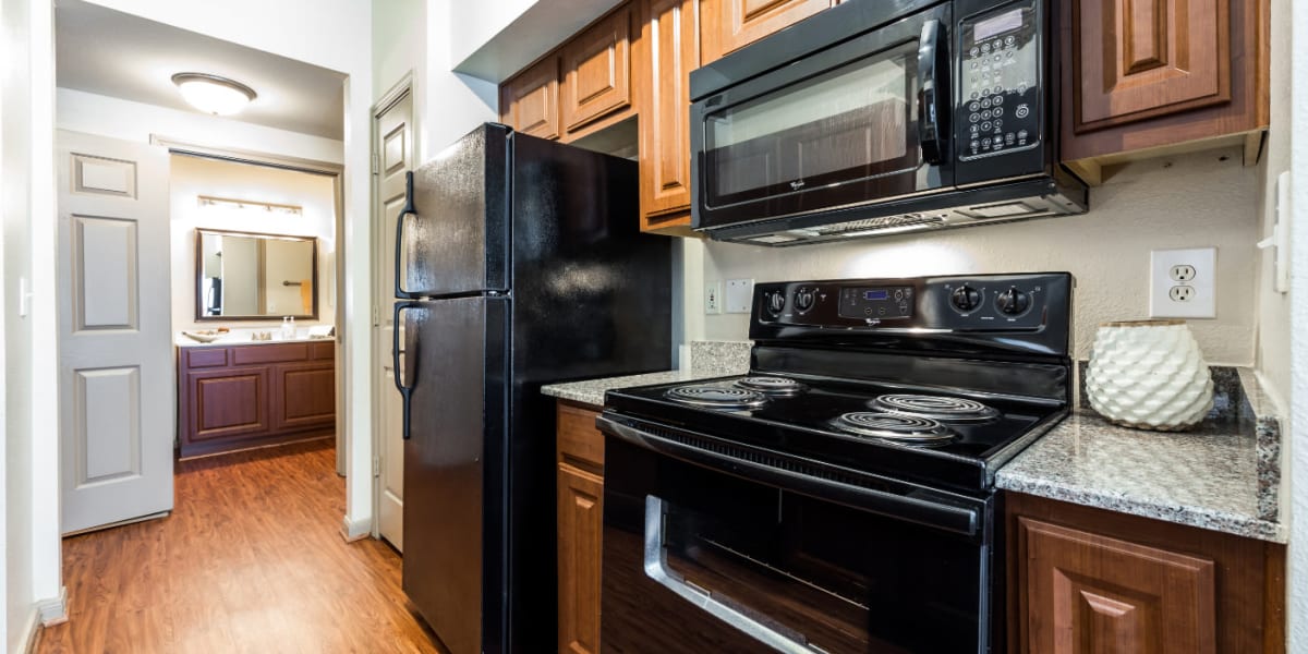 Pass through area of kitchen towards bathroom at Marquis on Park Row in Houston, Texas