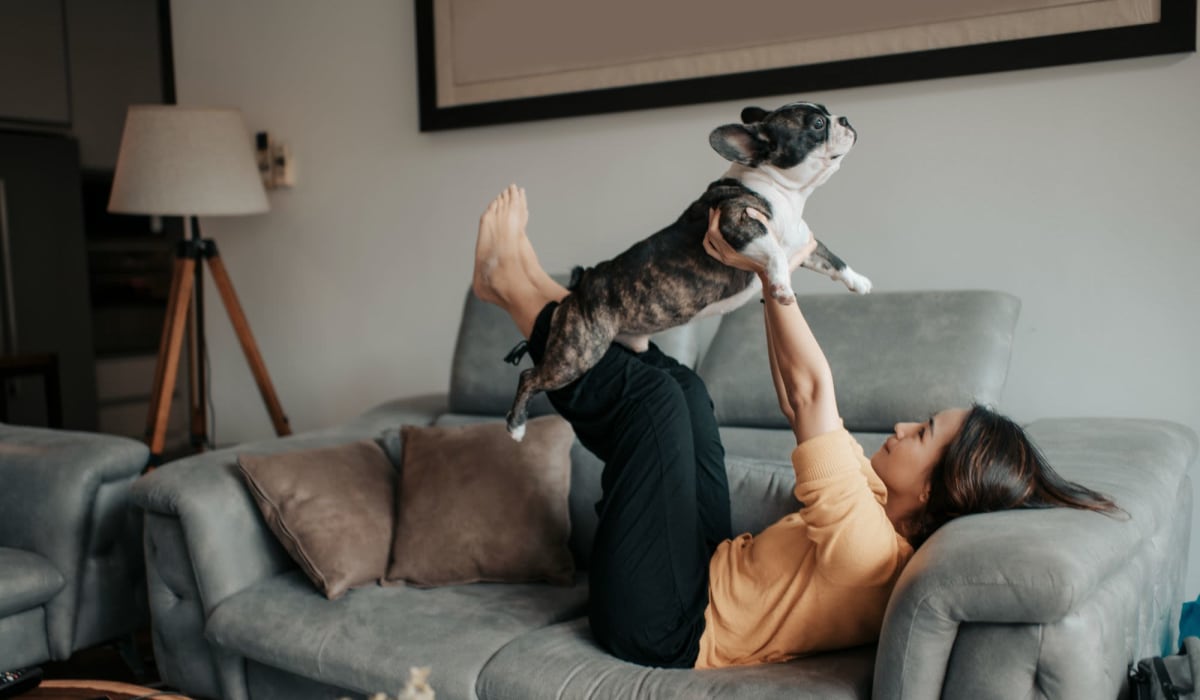 Resident playing with her dog at The Commons at Olentangy in Columbus, Ohio