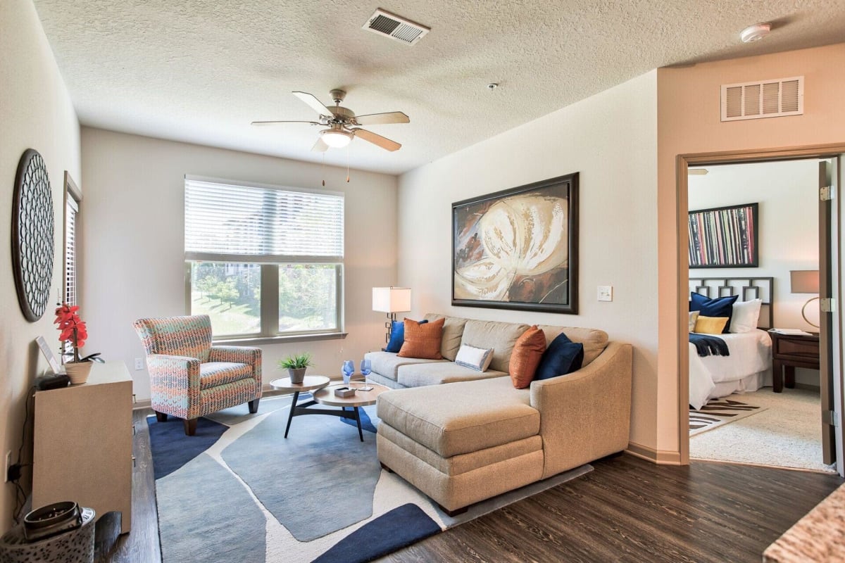 Wood-style flooring in an apartment living room at Sawgrass Creek in New Port Richey, Florida