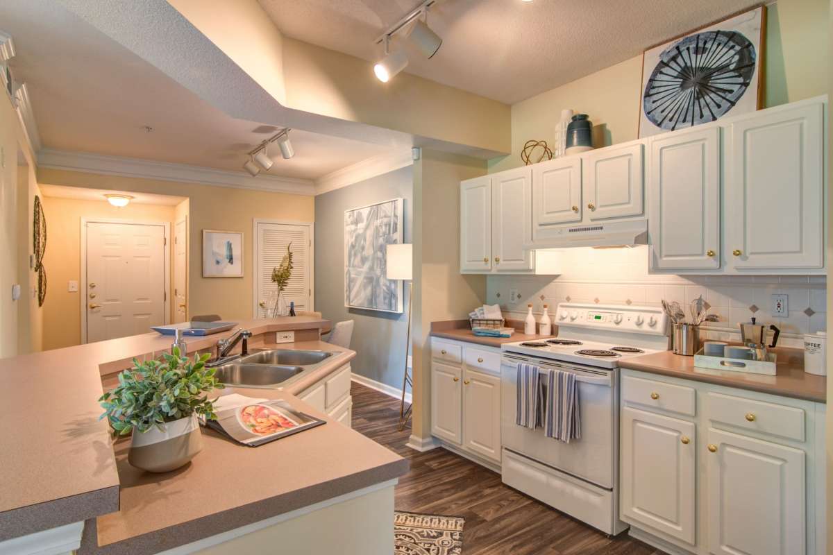 Kitchen with white cabinets at Alta Mill Apartments, Austell, Georgia