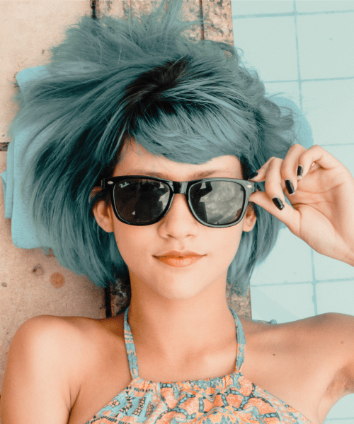 Girl with cool blue hair by the pool at Lofts at Capricorn in Macon, Georgia 