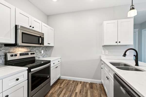 Apartment kitchen with stainless-steel appliances at Palomar Apartments in Lexington, Kentucky
