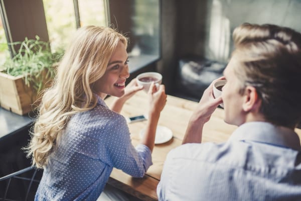 Residents enjoying their morning coffee in their modern kitchen at Banyan on Washington in Phoenix, AZ