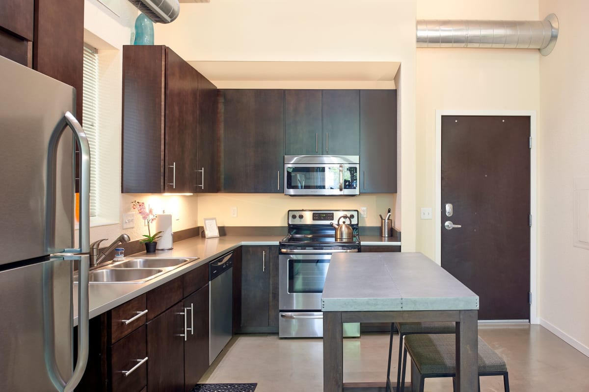 Apartment kitchen with an island at Flux in Minneapolis, Minnesota
