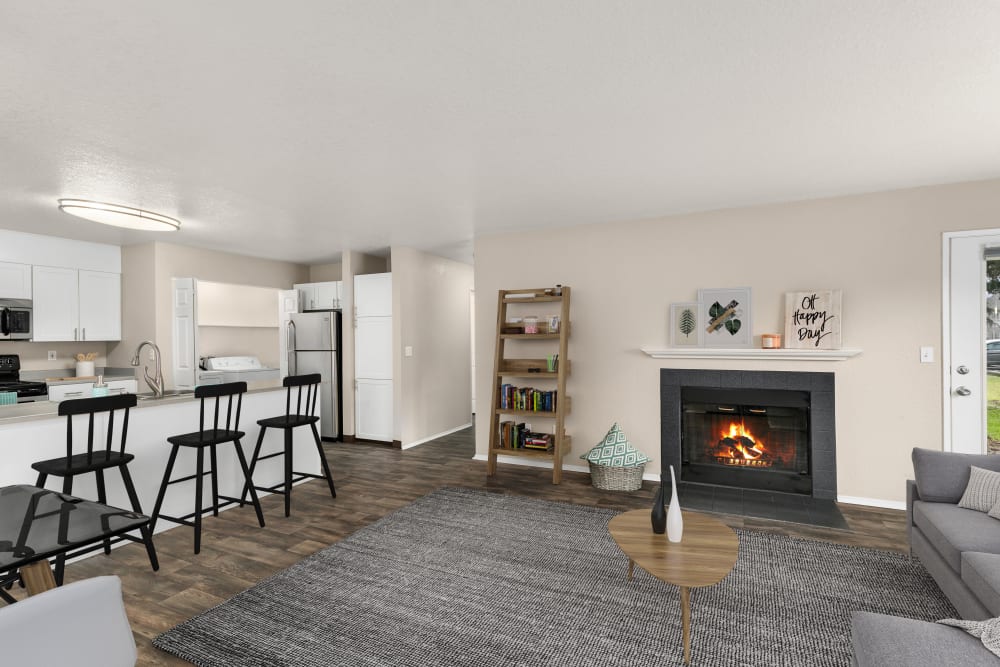 Cozy up to a fireplace in your living room at Carriage Park Apartments in Vancouver, Washington