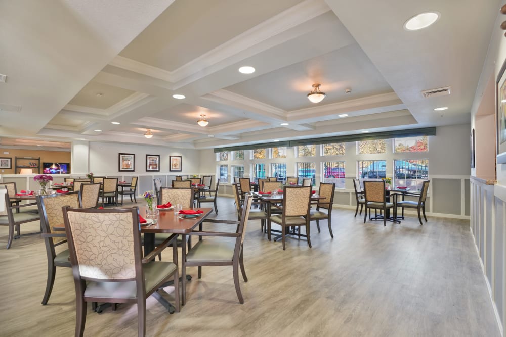 Dining hall with tract lighting at Almond Heights in Orangevale, California