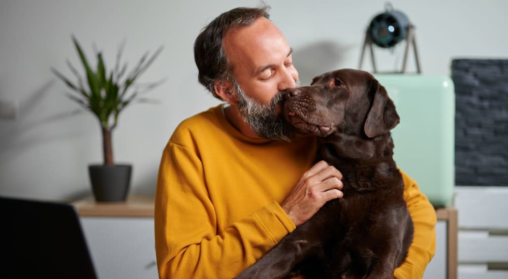 A resident with his dog at The Tower at Hollywood Hills in Los Angeles, California