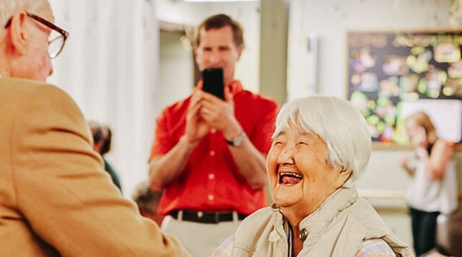 Don dancing with resident at Cascade Park Gardens Memory Care in Tacoma, Washington