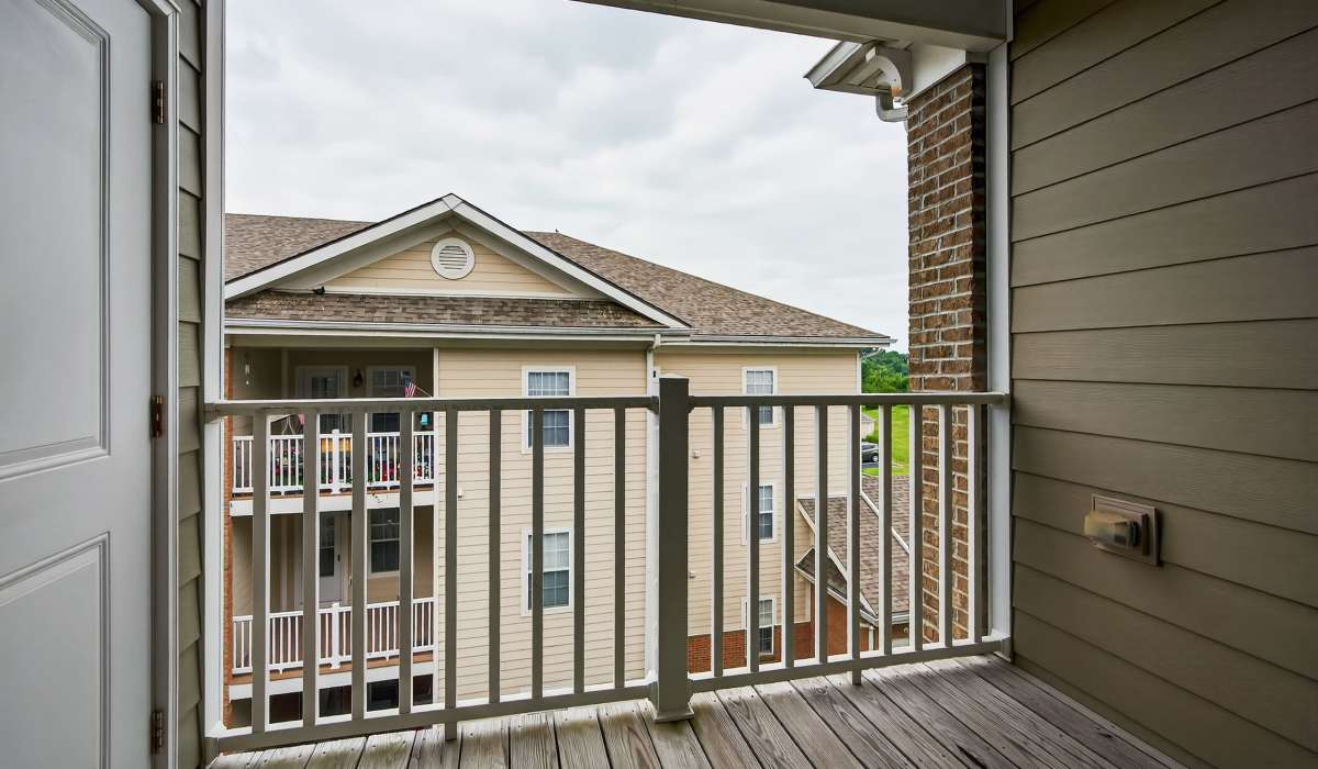 Private balcony with plank wood-style flooring at Palomar View Apartments in Lexington, Kentucky