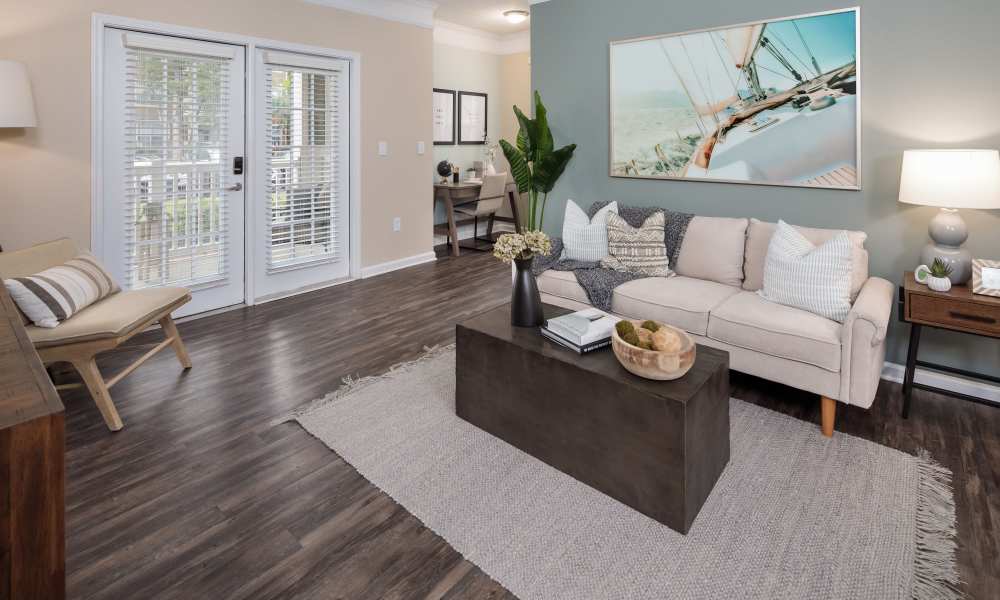Living room with windows at Bryant at Summerville in Summerville, South Carolina 