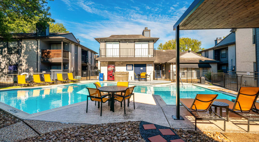 Residents out for a barbeque next to the pool at The Legacy at Clear Lake in Webster, Texas