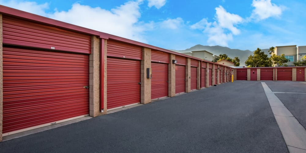 Outdoor storage units with red doors at StorQuest Self Storage in Rancho Cucamonga, California