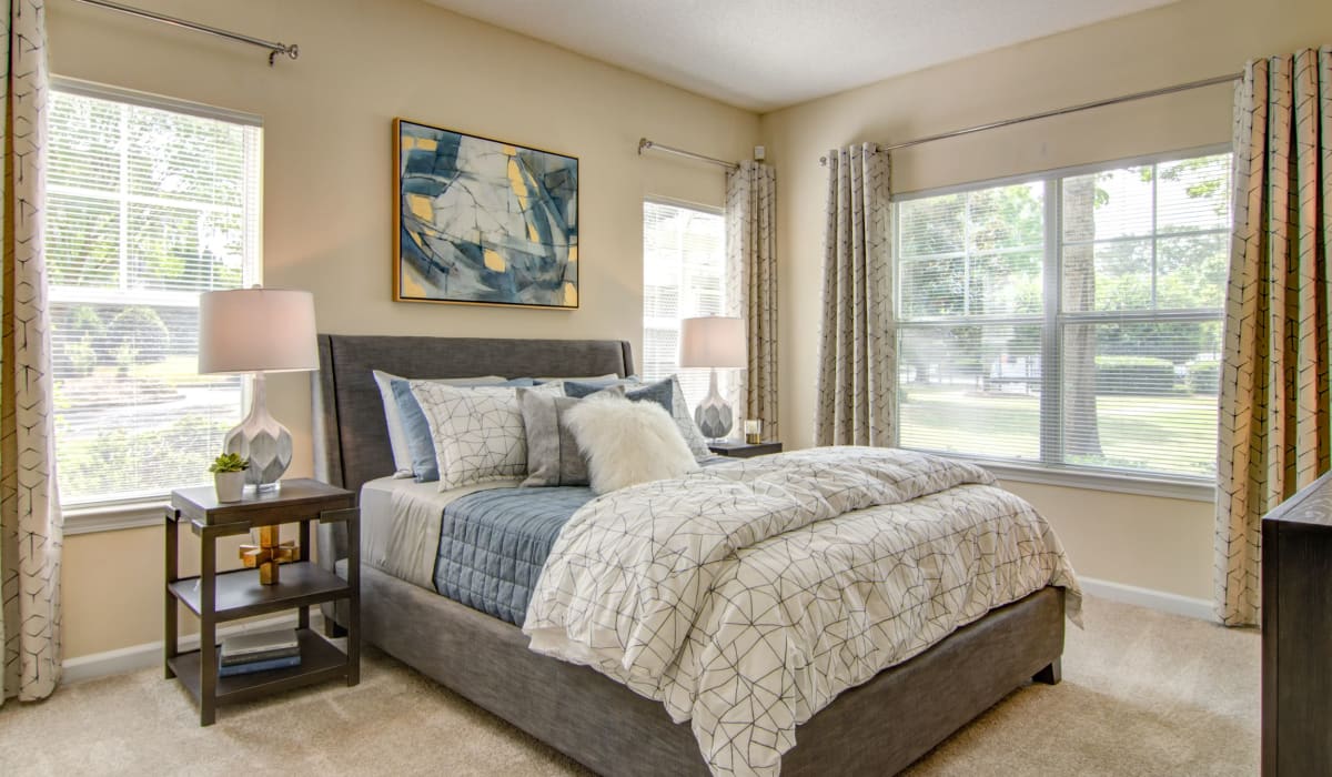 Bedroom with large windows at Alta Mill Apartments, Austell, Georgia