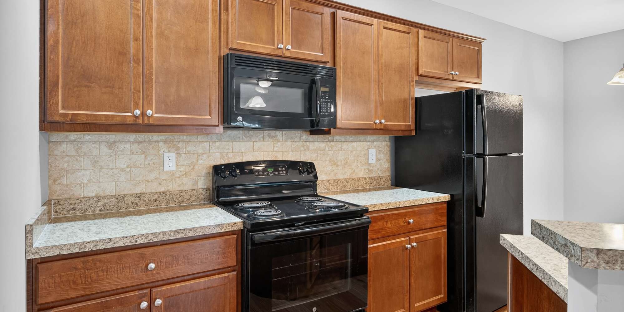Apartment kitchen with black appliances at Palomar View Apartments in Lexington,Kentucky