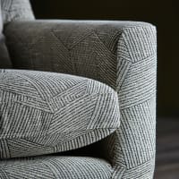 Close-up of a patterned grey sofa in a model home at 747 in Indianapolis, Indiana