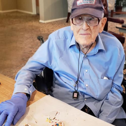 Resident decorating cookies at Canoe Brook Assisted Living & Memory Care in Catoosa, Oklahoma