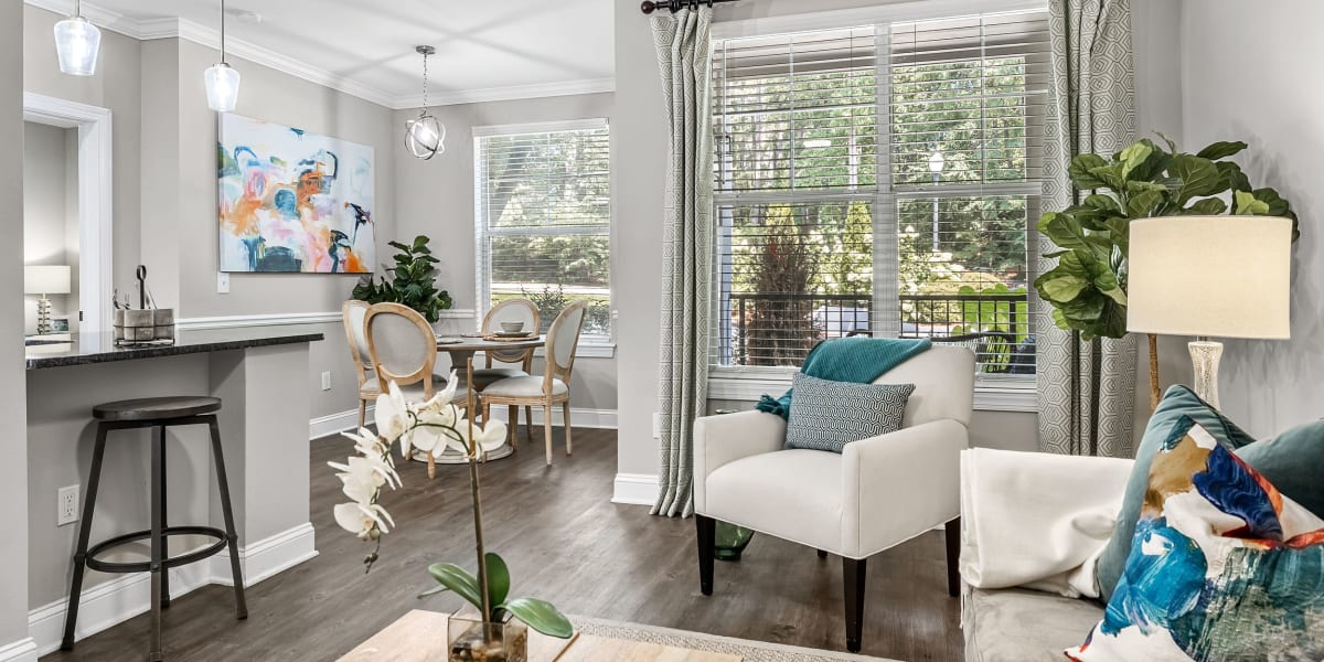 Living room with patio access at Marq Perimeter in Atlanta, Georgia