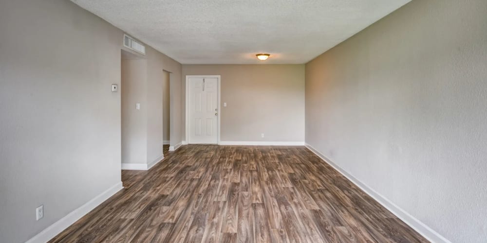 Wood-style flooring in an apartment living room at Costa Del Lago in Lake Worth, Florida