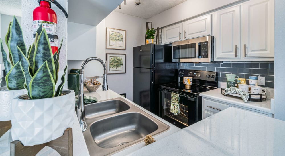 Modern kitchen with ample counter space at The Legacy at Clear Lake in Webster, Texas